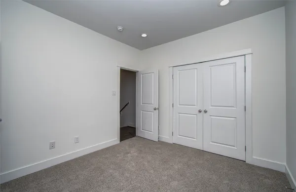 a bathroom with a bathtub and a toilet