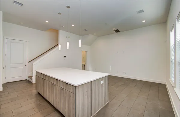 a kitchen with stainless steel appliances sink stove microwave and cabinets