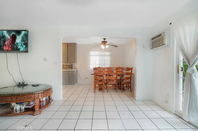 a dining room with furniture and a chandelier