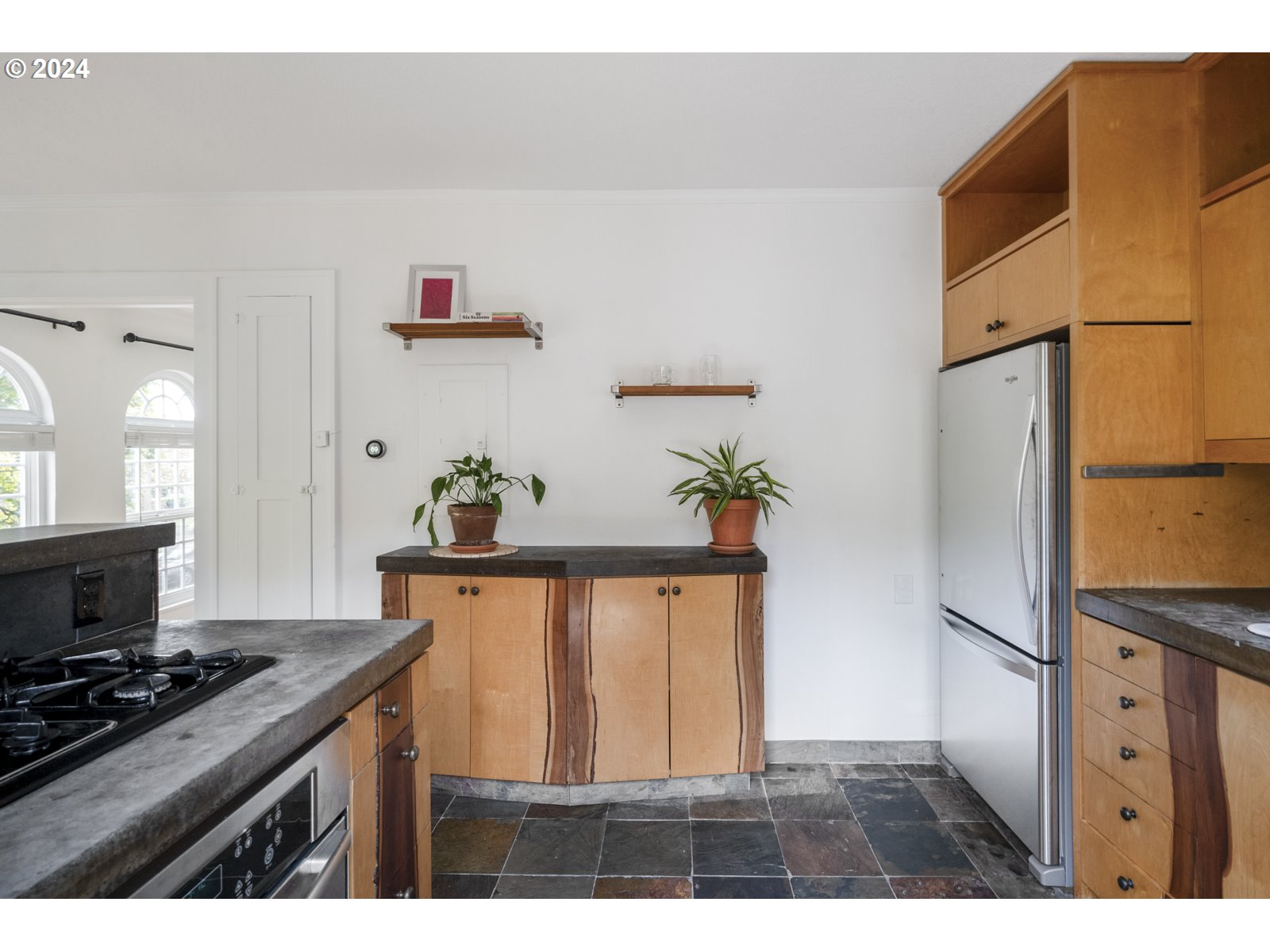 909 Northeast Brazee Street, Unit 17 Portland, OR 97212 - Photo 20 of 47 a living room with stainless steel appliances kitchen island a stove and a refrigerator