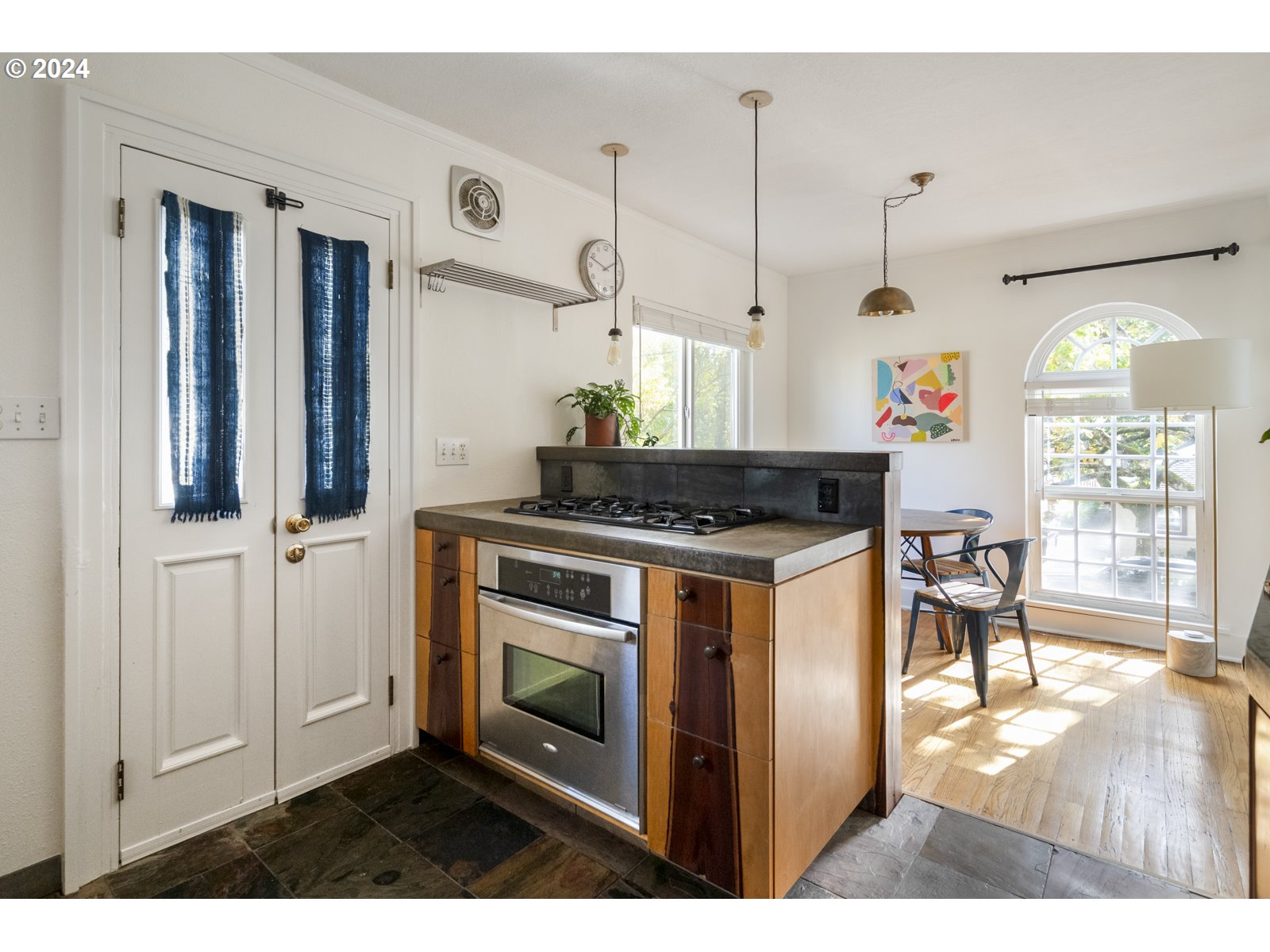 909 Northeast Brazee Street, Unit 17 Portland, OR 97212 - Photo 22 of 47 a kitchen with stainless steel appliances granite countertop a stove a sink and a refrigerator