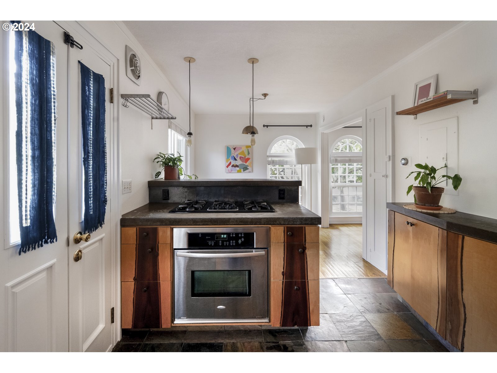 909 Northeast Brazee Street, Unit 17 Portland, OR 97212 - Photo 23 of 47 a kitchen with stainless steel appliances a stove and a refrigerator