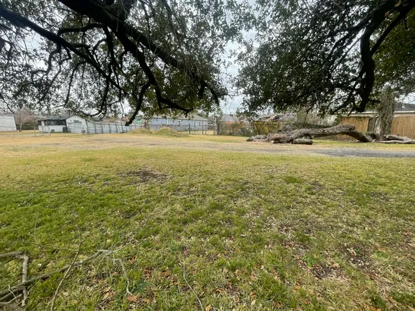 a view of yard with swimming pool and trees