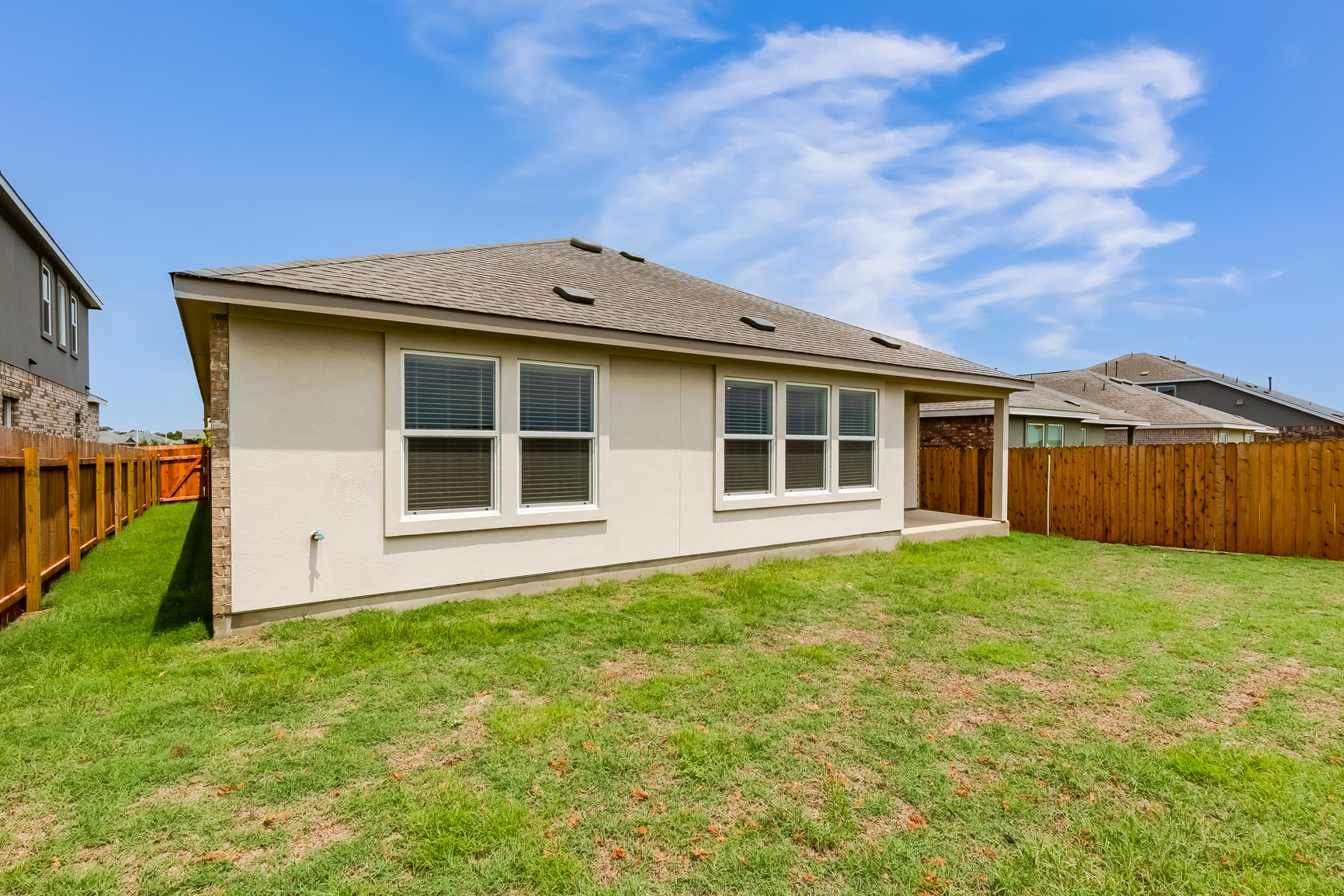 2000 Gilmer Way Leander, TX 78641 - Photo 29 of 39 Rear view of house with stucco siding