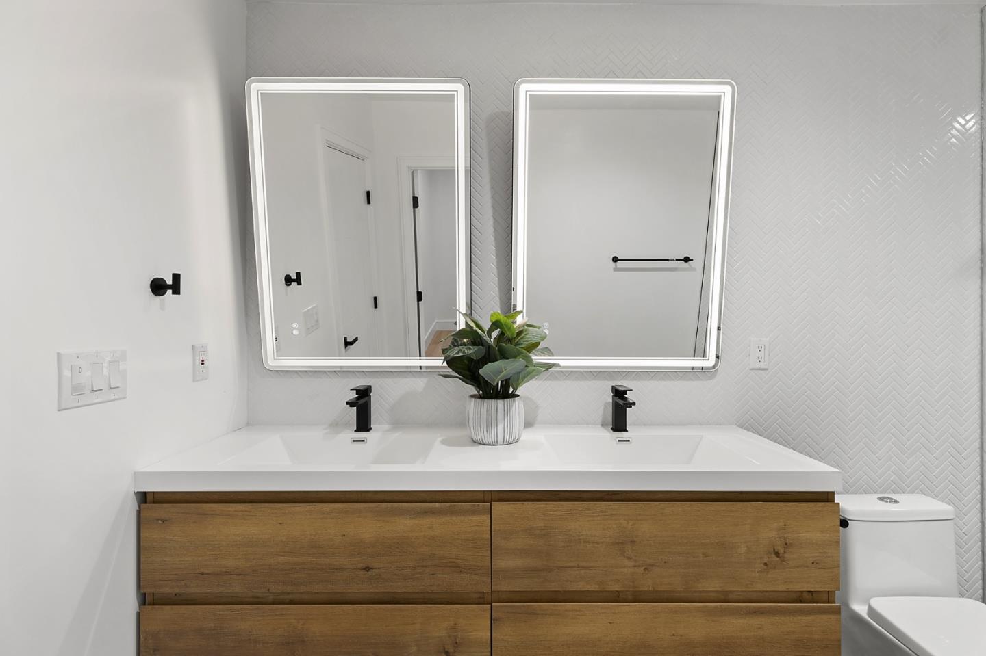 1265 Burrows Road Campbell, CA 95008 - Photo 30 of 42 a bathroom with a sink a toilet and mirror