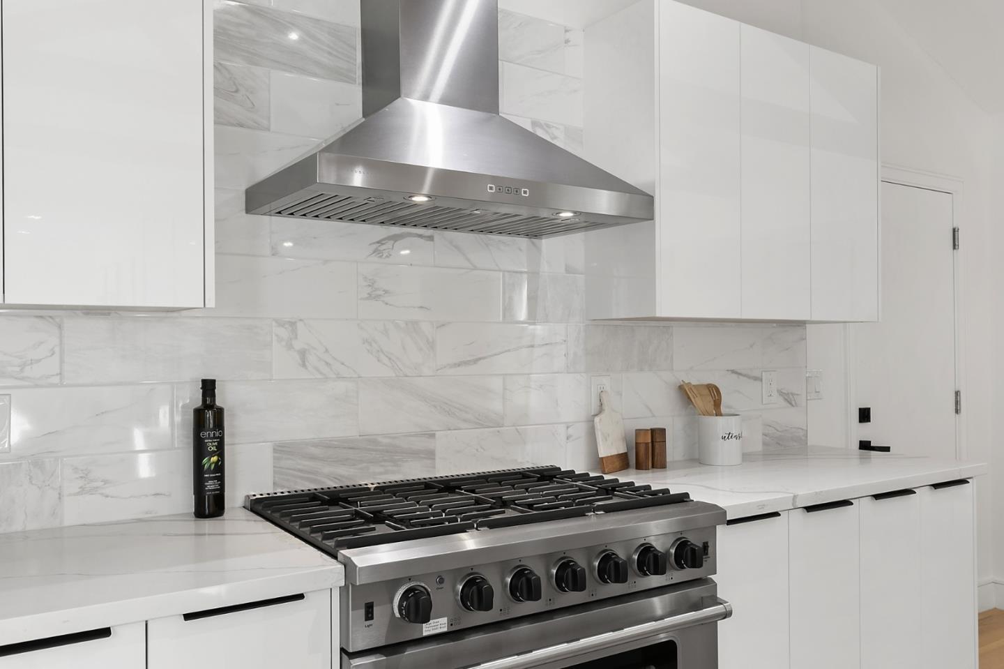 1265 Burrows Road Campbell, CA 95008 - Photo 10 of 42 a stove top oven sitting inside of a kitchen