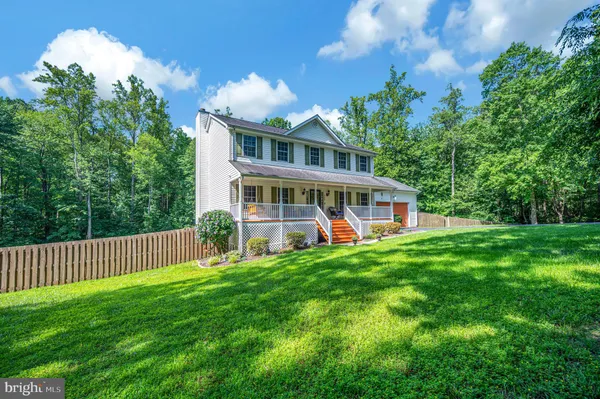 a view of a house with a big yard