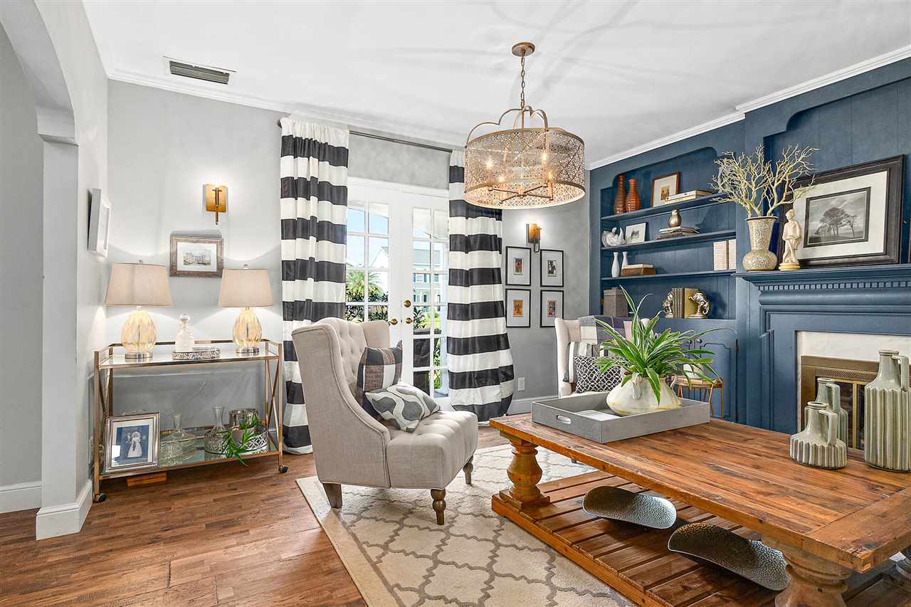 205 Oglethorpe Boulevard St. Augustine, FL 32080 - Photo 19 of 48 a room with fireplace furniture and a chandelier