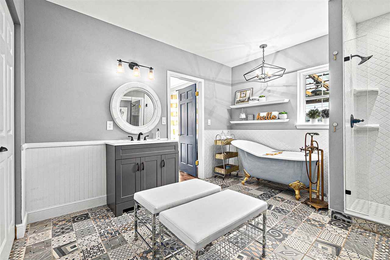 205 Oglethorpe Boulevard St. Augustine, FL 32080 - Photo 25 of 48 a living room with furniture and a mirror