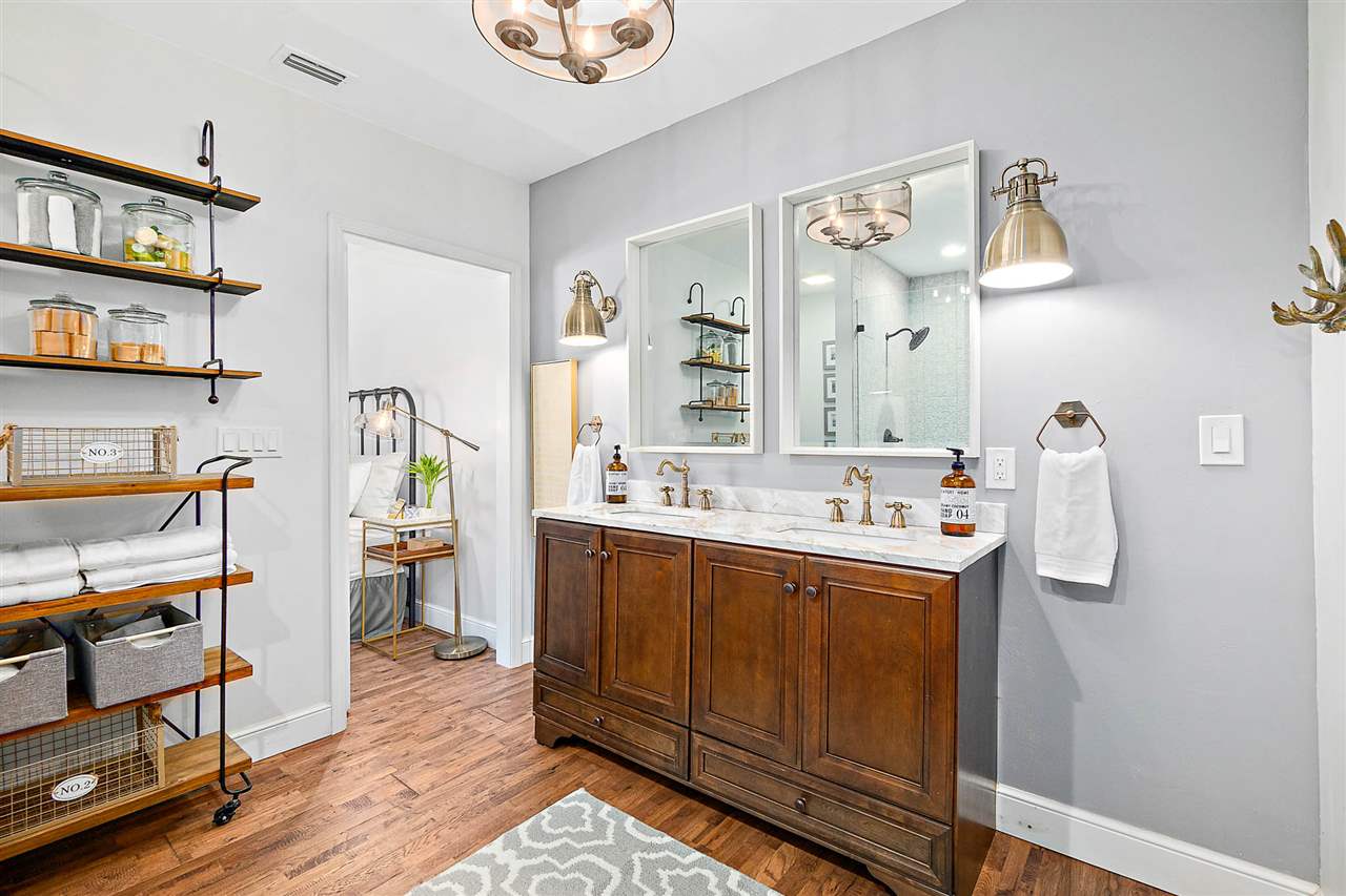 205 Oglethorpe Boulevard St. Augustine, FL 32080 - Photo 27 of 48 a bathroom with a sink a vanity and a mirror