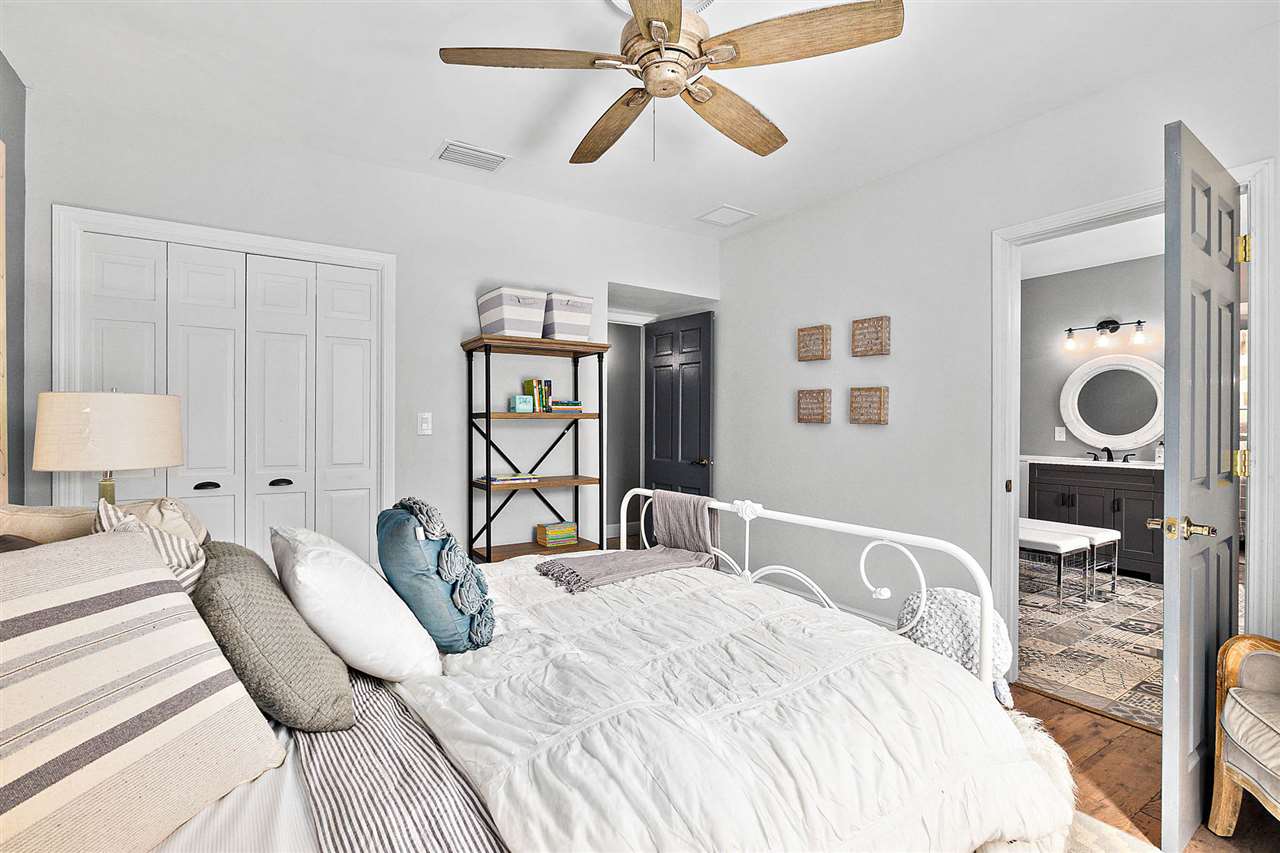 205 Oglethorpe Boulevard St. Augustine, FL 32080 - Photo 30 of 48 a bedroom with a bed and a chandelier