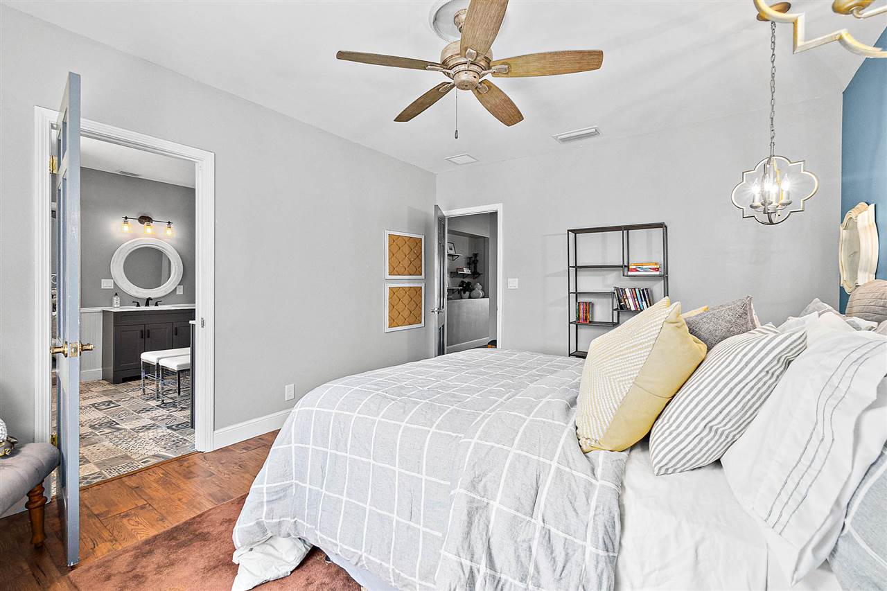 205 Oglethorpe Boulevard St. Augustine, FL 32080 - Photo 31 of 48 a bedroom with a bed and a chandelier