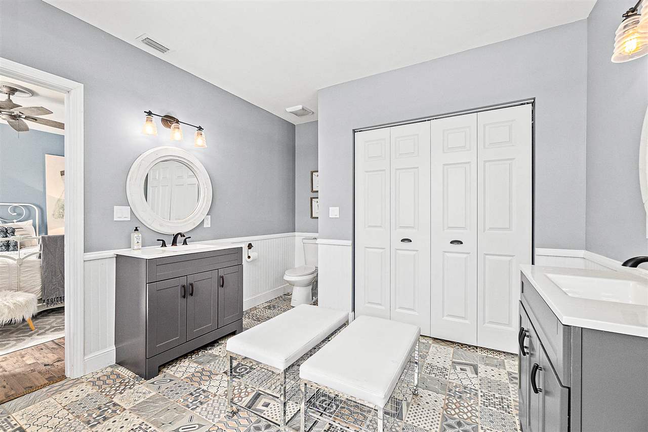 205 Oglethorpe Boulevard St. Augustine, FL 32080 - Photo 32 of 48 a spacious bathroom with a sink and a mirror