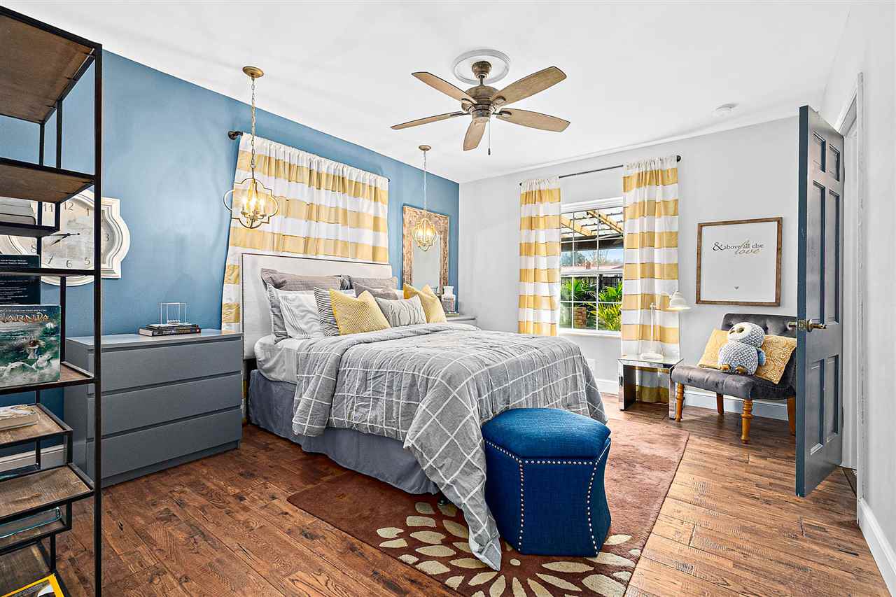 205 Oglethorpe Boulevard St. Augustine, FL 32080 - Photo 34 of 48 a bedroom with a large bed and a chandelier