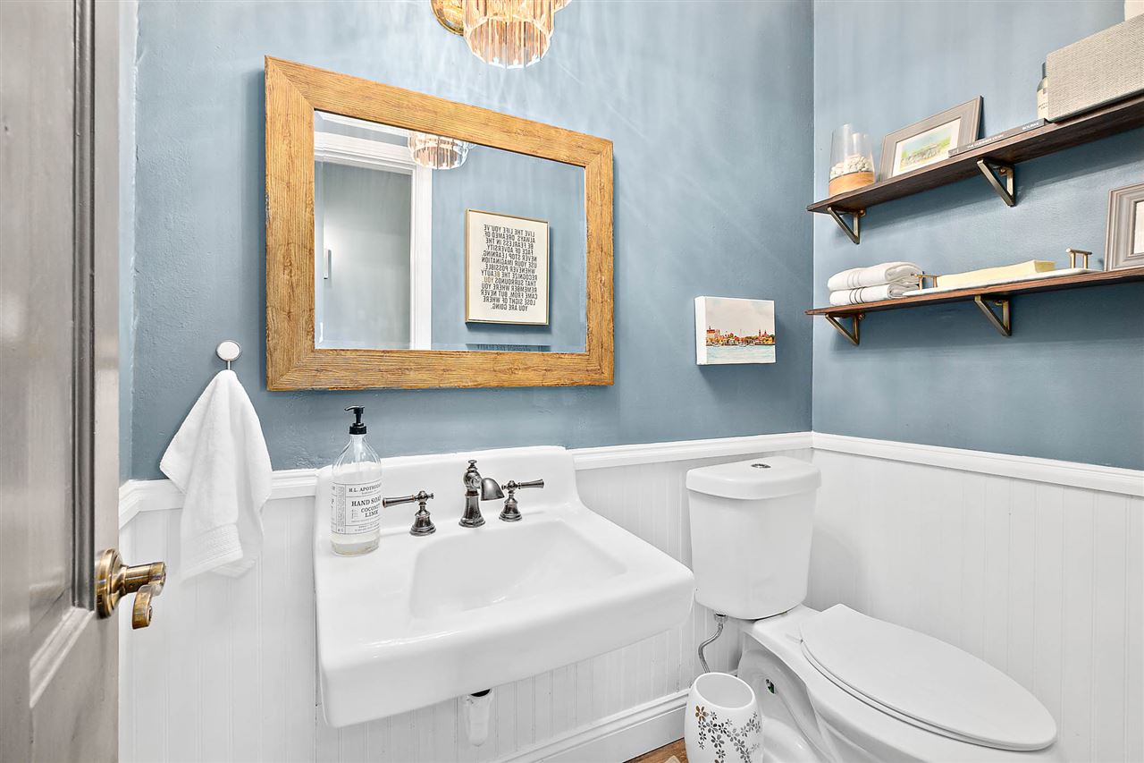 205 Oglethorpe Boulevard St. Augustine, FL 32080 - Photo 37 of 48 a white toilet sitting next to a bathroom sink