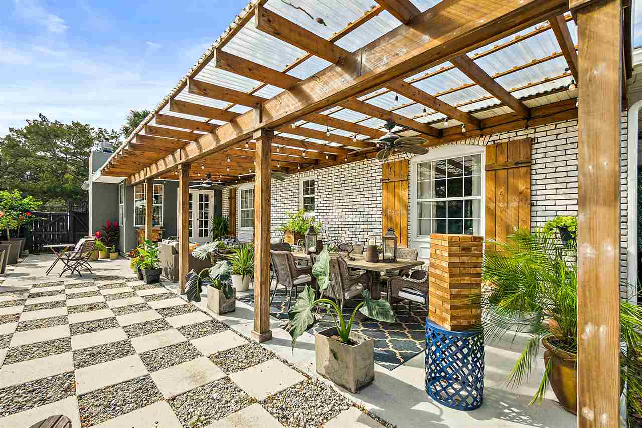 205 Oglethorpe Boulevard St. Augustine, FL 32080 - Photo 44 of 48 a view of a patio with table and chairs and potted plants