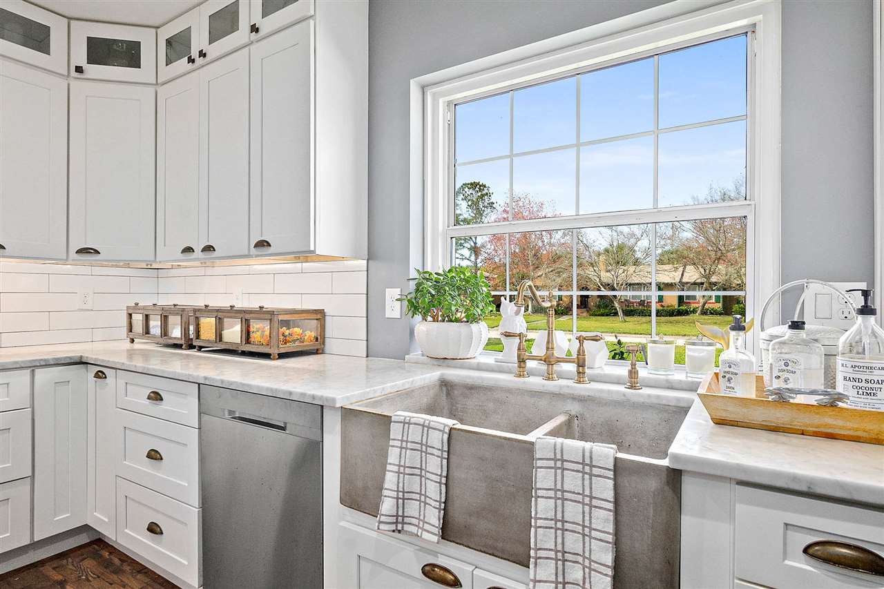 205 Oglethorpe Boulevard St. Augustine, FL 32080 - Photo 7 of 48 a kitchen with stainless steel appliances a sink a stove and a window