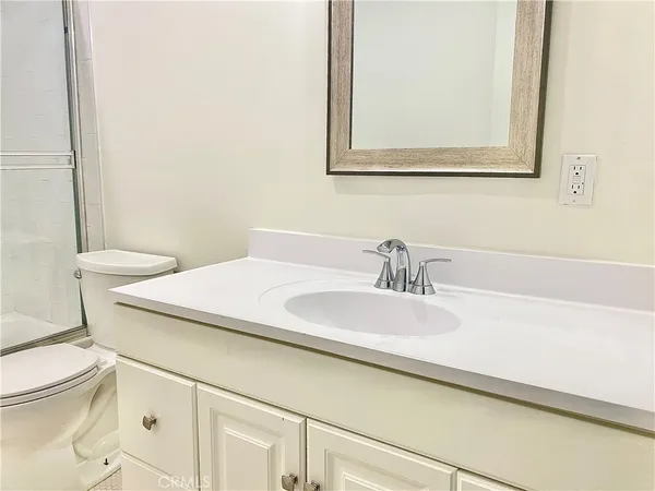 a white refrigerator freezer sitting inside of a kitchen