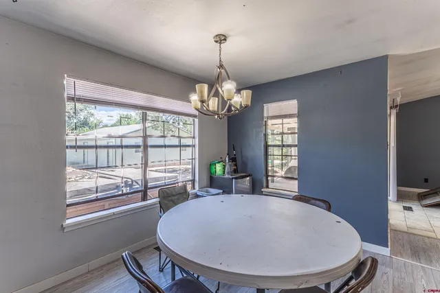 a view of a livingroom with furniture window and wooden floor