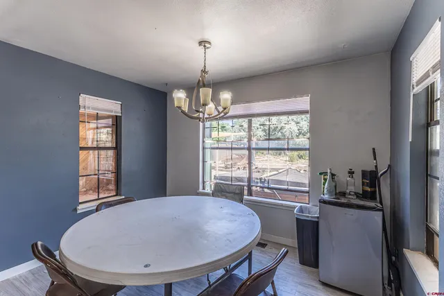 a view of a dining room with furniture window and outside view