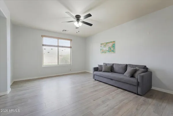 a living room with furniture and a window