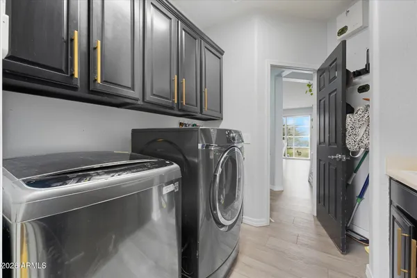 a utility room with dryer and washer
