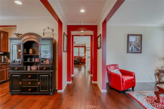 a living room with furniture a rug and a lamp
