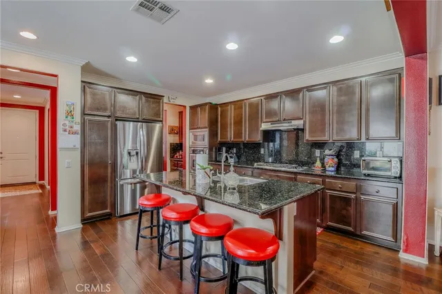 a livingroom with furniture window and wooden floor
