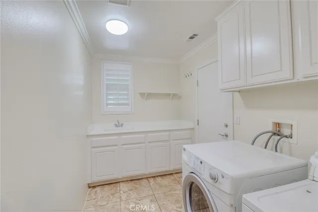 a view of a patio with table and chairs and potted plants