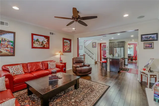 a roof deck with table and chairs and potted plants