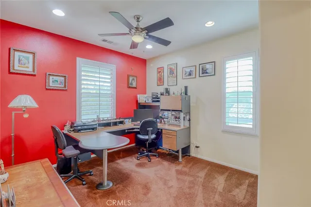 a bathroom with a bathtub sink and mirror