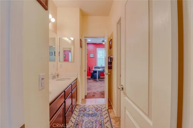 a en suite bathroom with a sink and a mirror