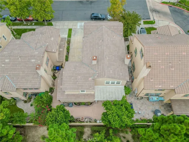 an aerial view of a house with outdoor space and street view