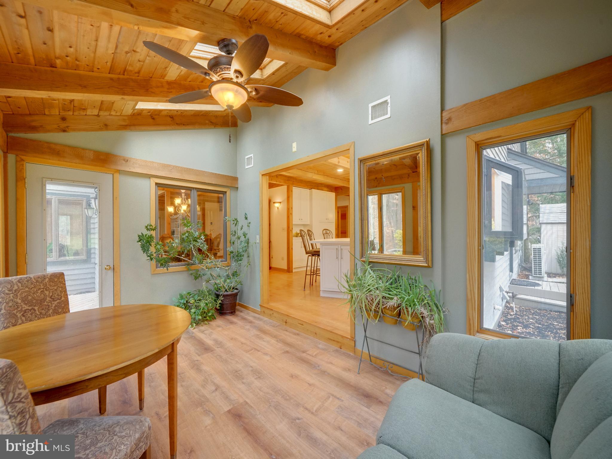 11818 Linden Chapel Road Clarksville, MD 21029 - Photo 21 of 121 a living room with furniture a chandelier and a dining table