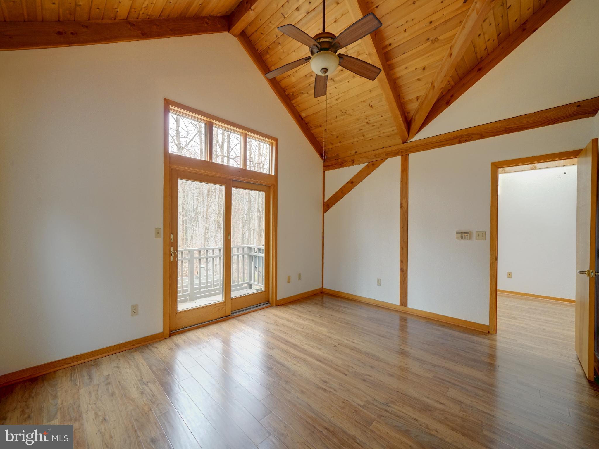 11818 Linden Chapel Road Clarksville, MD 21029 - Photo 40 of 121 a view of an empty room with wooden floor and a window