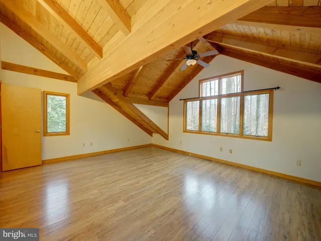 a view of a green field with lots of bushes