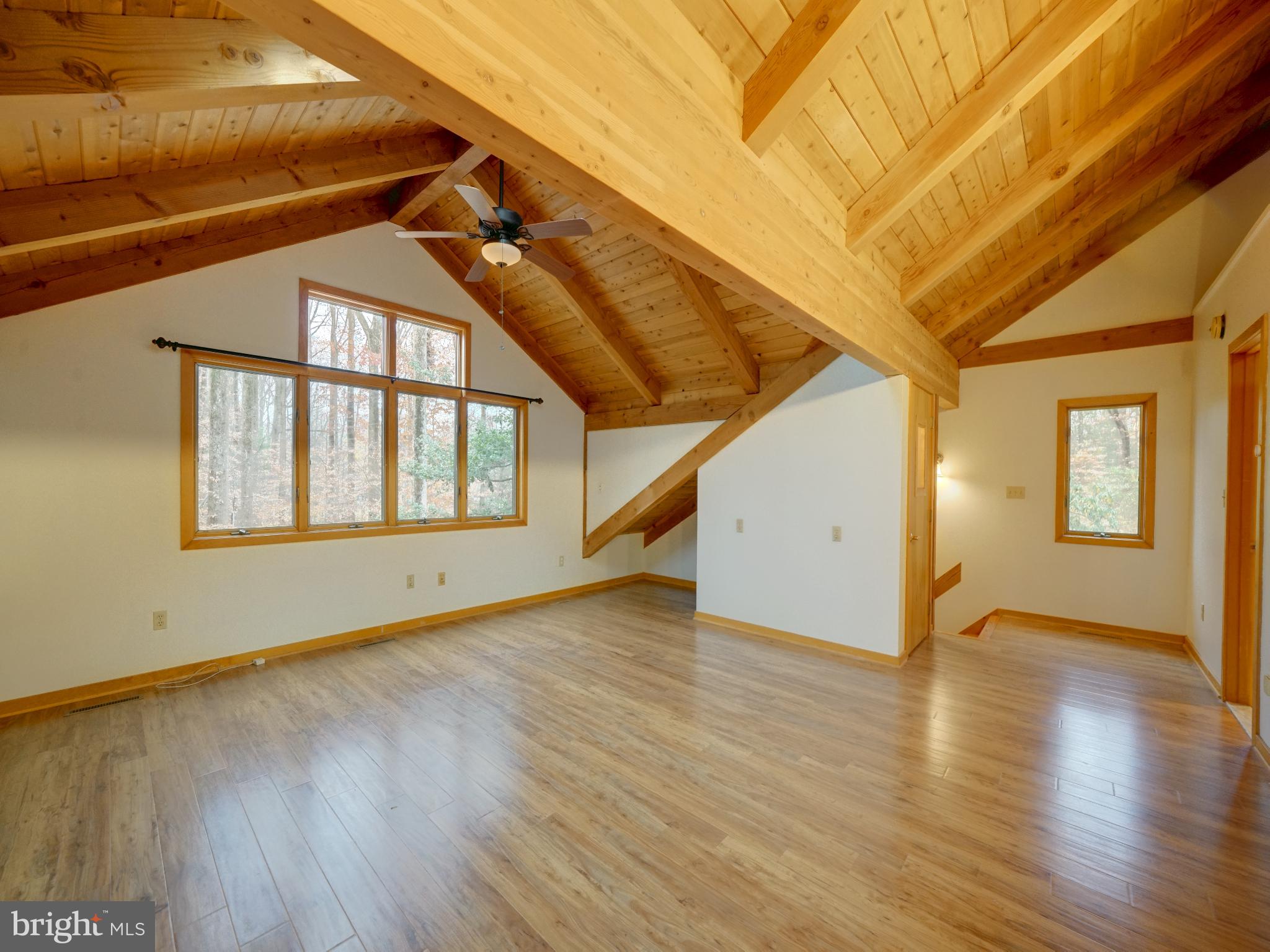 11818 Linden Chapel Road Clarksville, MD 21029 - Photo 56 of 121 a view of an empty room with wooden floor and windows