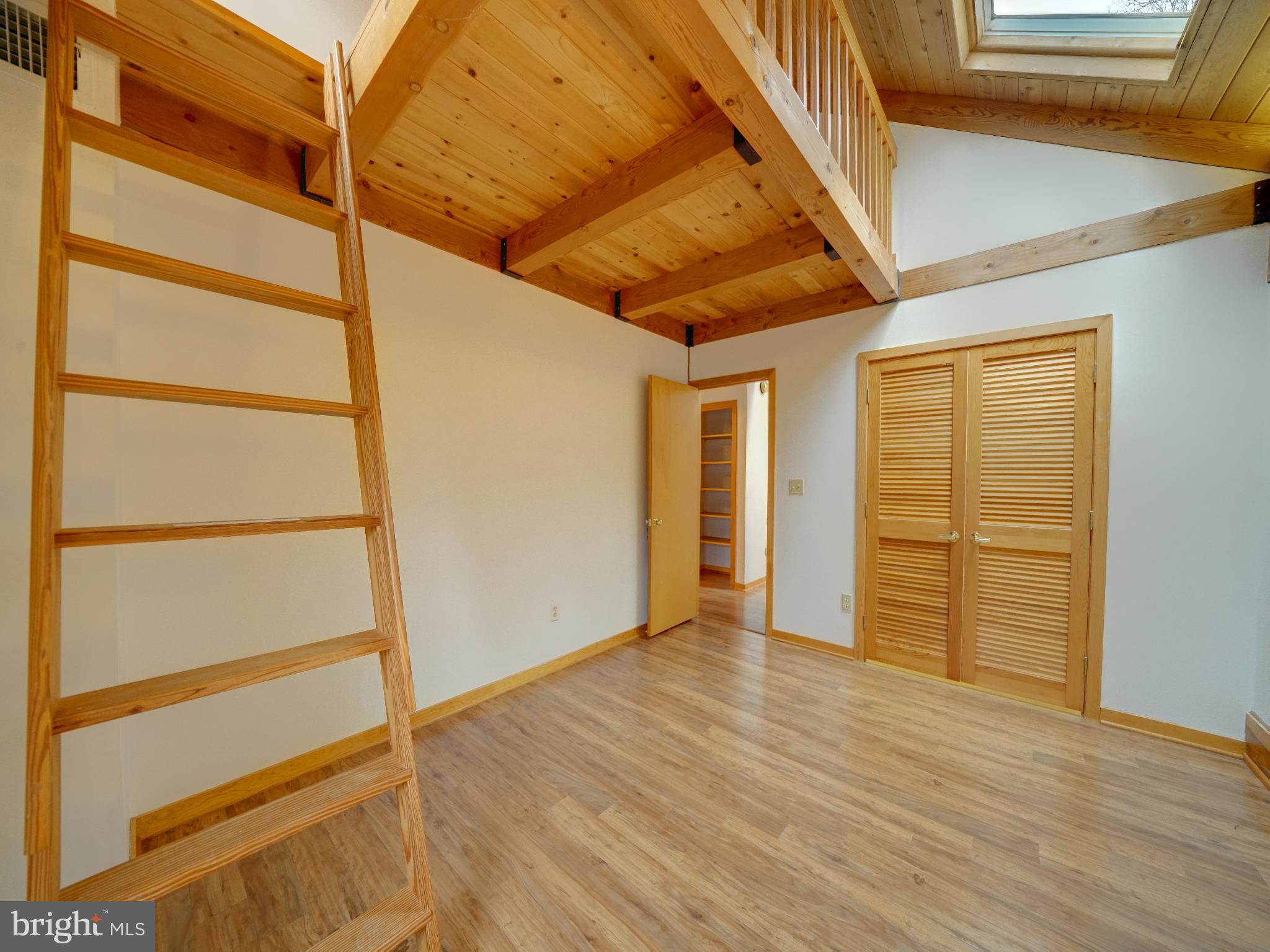 11818 Linden Chapel Road Clarksville, MD 21029 - Photo 69 of 121 a view of an empty room with wooden floor and a window