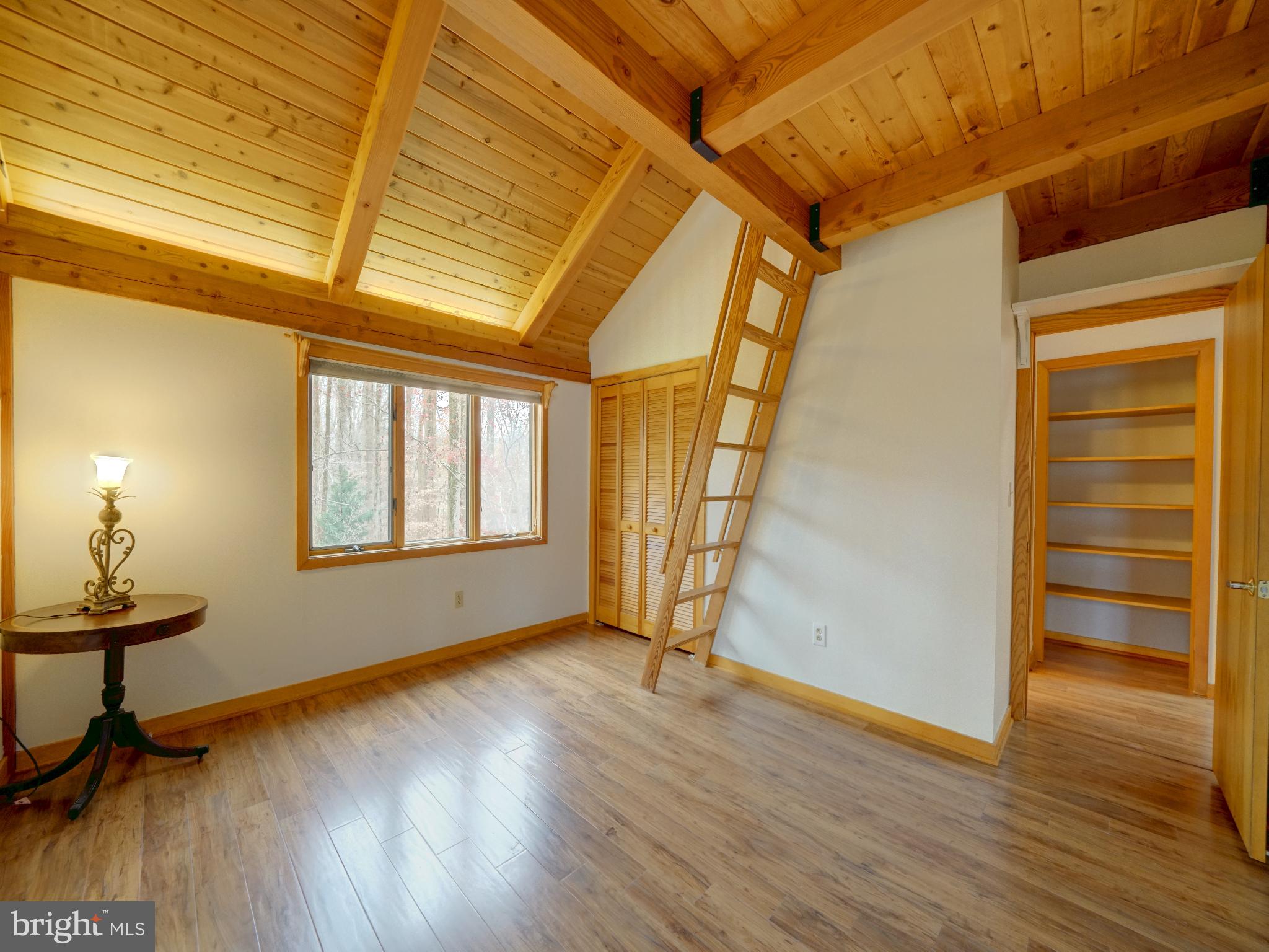 11818 Linden Chapel Road Clarksville, MD 21029 - Photo 74 of 121 a view of an empty room with a window and wooden floor