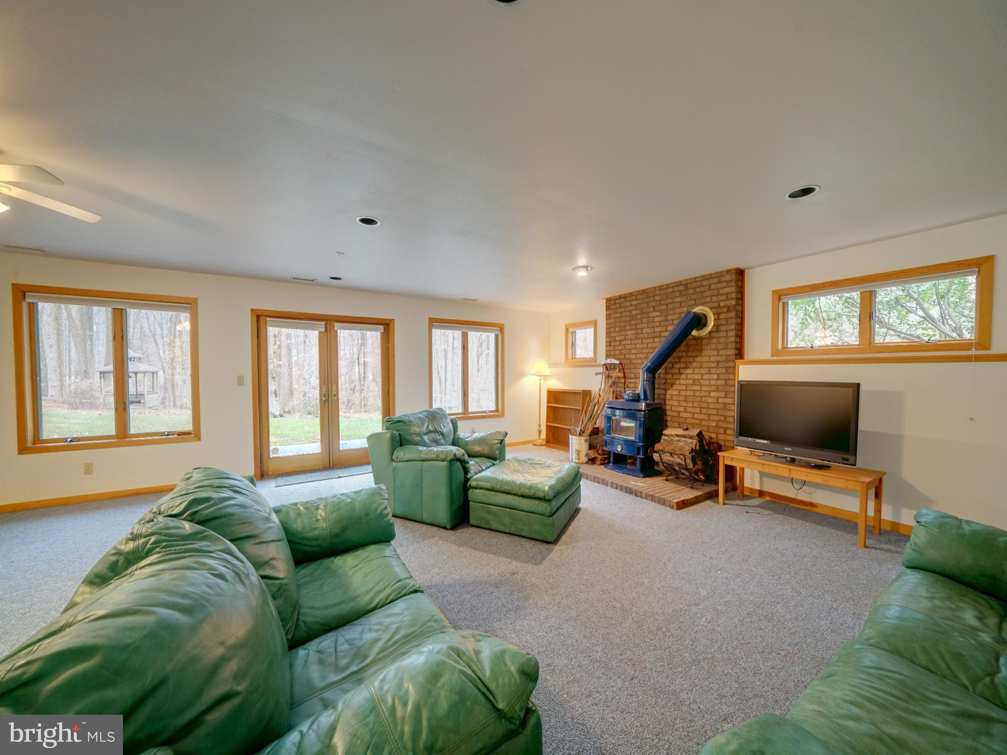 11818 Linden Chapel Road Clarksville, MD 21029 - Photo 85 of 121 a living room with furniture and a flat screen tv