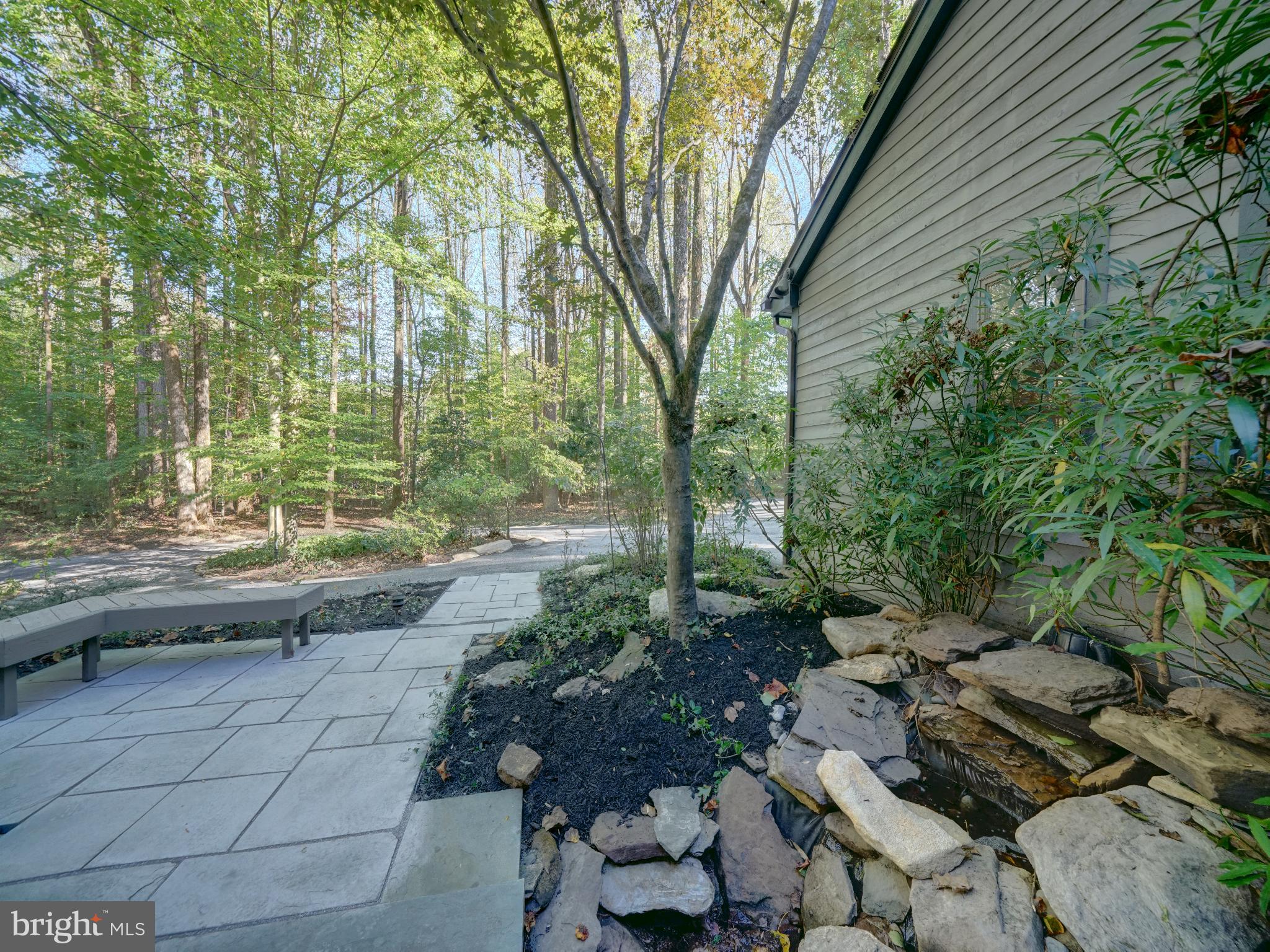 11818 Linden Chapel Road Clarksville, MD 21029 - Photo 98 of 121 a view of backyard with table and chairs and large trees