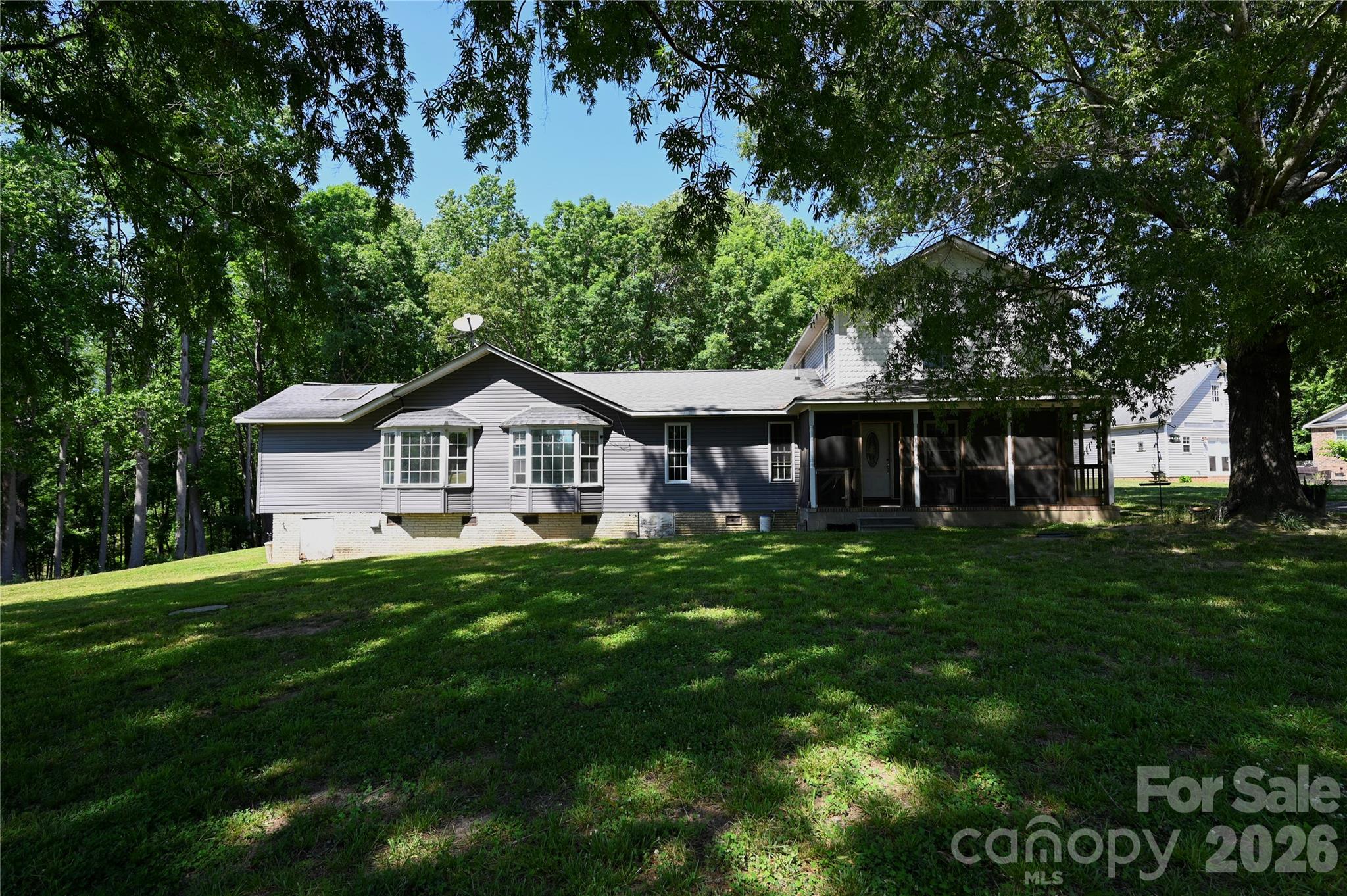 1845 State Rd S-46-149 Clover, SC 29710 - Photo 28 of 28 a front view of a house with a yard and trees