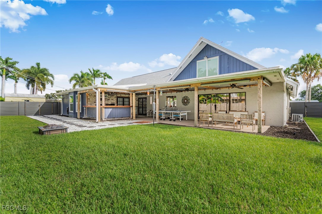 1549 Braeburn Road Fort Myers, FL 33919 - Photo 1 of 38 a view of a house with a yard porch and sitting area