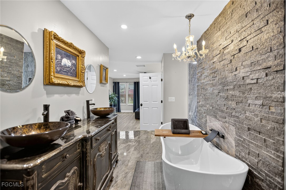 1549 Braeburn Road Fort Myers, FL 33919 - Photo 25 of 38 a kitchen with a sink and a stove top oven