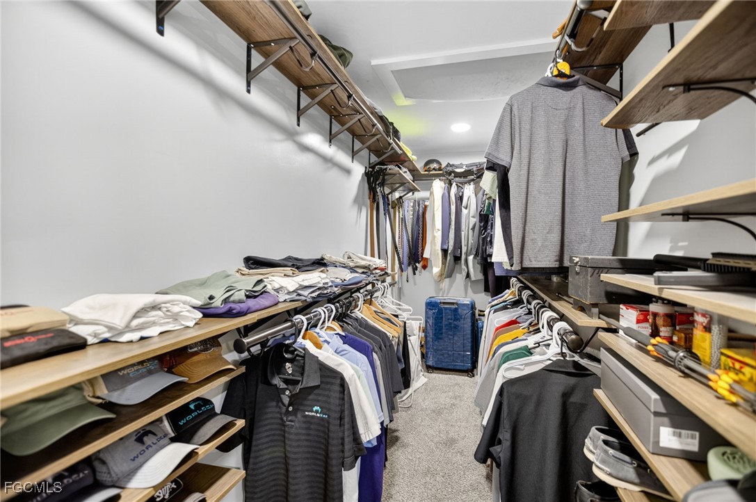1549 Braeburn Road Fort Myers, FL 33919 - Photo 26 of 38 a view of walk in closet with clothes and shoes