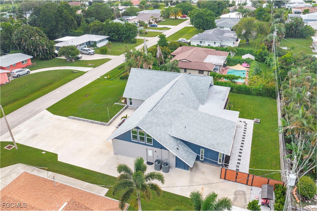 1549 Braeburn Road Fort Myers, FL 33919 - Photo 4 of 38 an aerial view of a house with a garden and trees