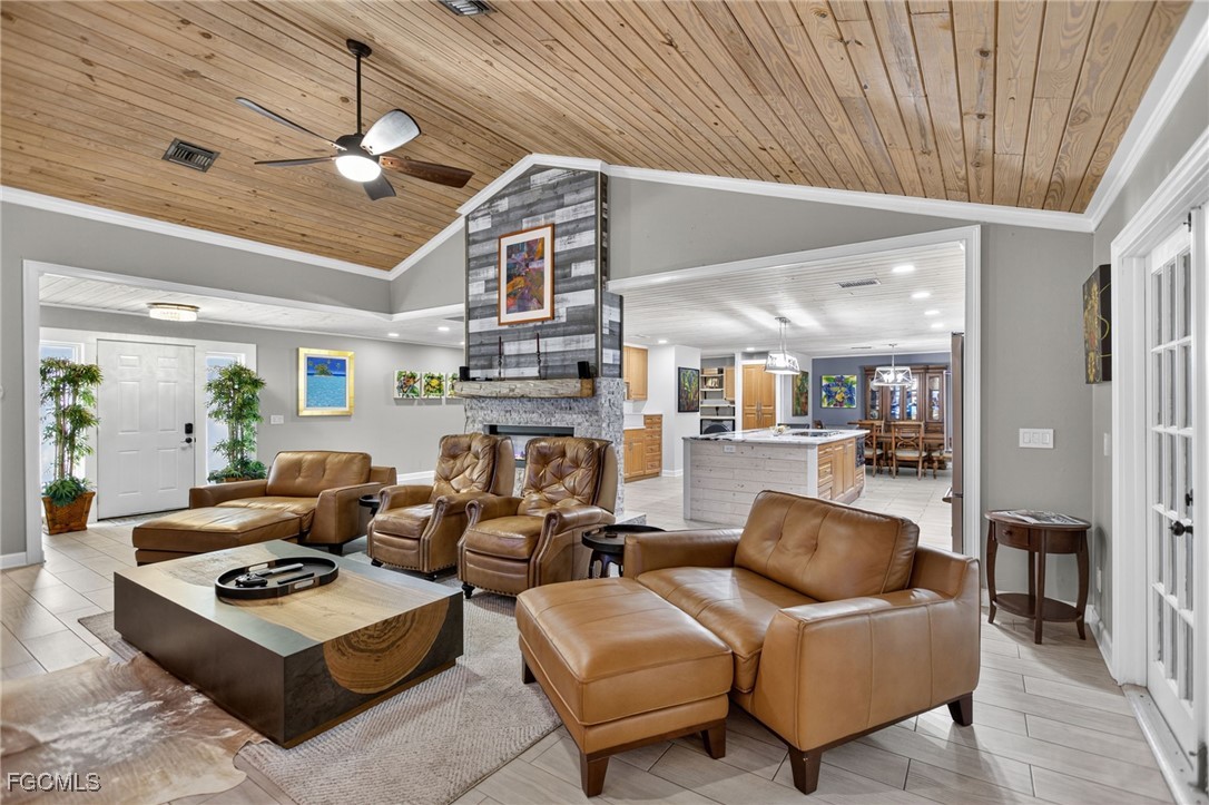 1549 Braeburn Road Fort Myers, FL 33919 - Photo 7 of 38 a living room with furniture and a chandelier
