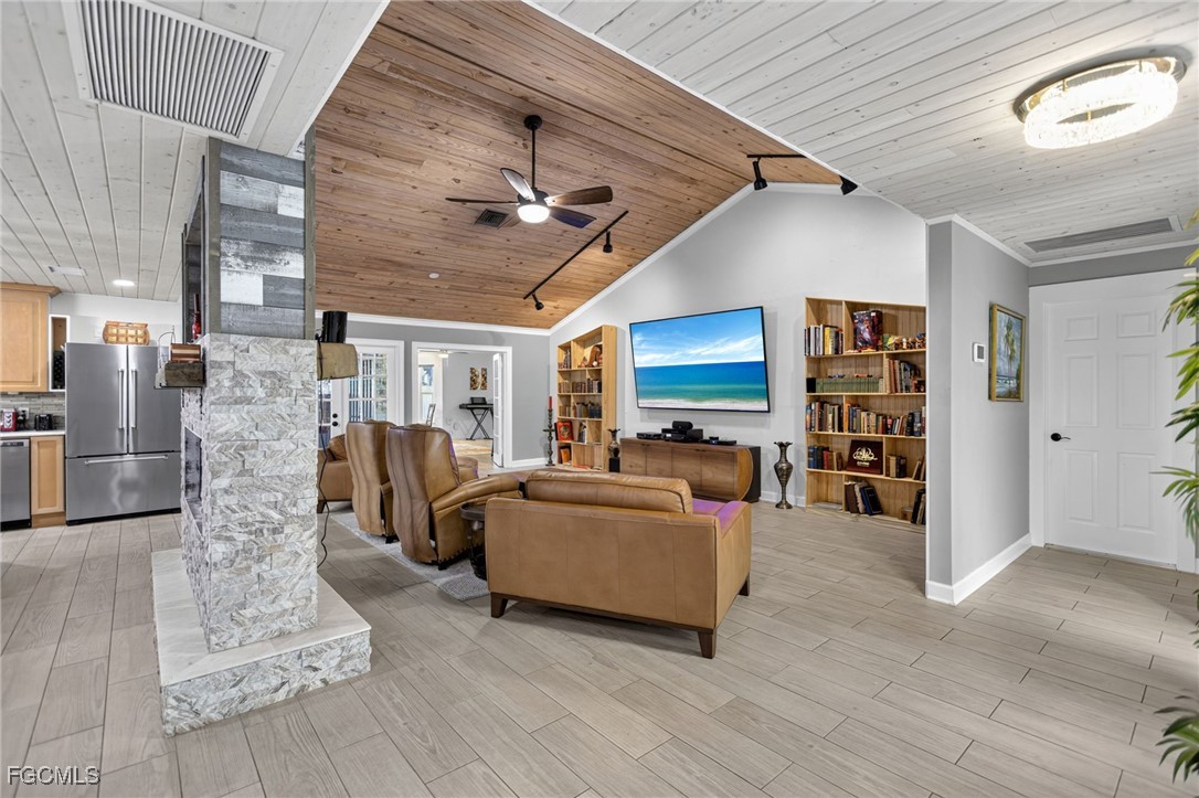 1549 Braeburn Road Fort Myers, FL 33919 - Photo 8 of 38 a living room with furniture and a flat screen tv