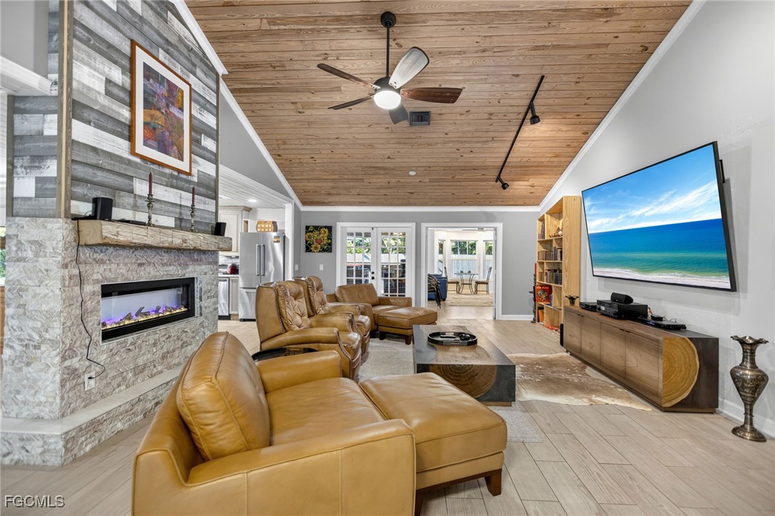 1549 Braeburn Road Fort Myers, FL 33919 - Photo 9 of 38 a living room with furniture and a flat screen tv