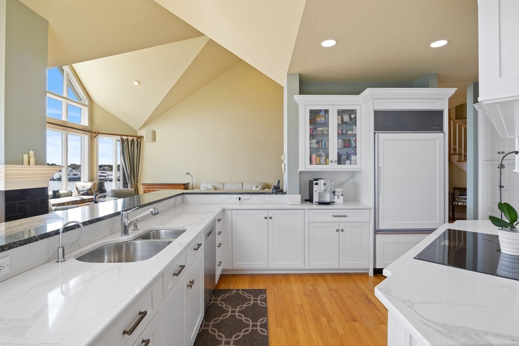 163 Little Harbor Road, Unit 163 New Castle, NH 03854 - Photo 19 of 36 a large kitchen with a sink large counter top space and stainless steel appliances